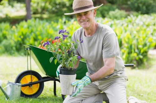 Gardening crew loading a van with soil and plant material